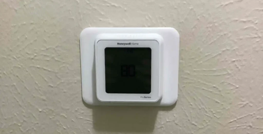 Newly installed Honeywell Home Pro Series thermostat on a wall